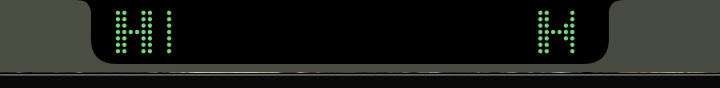 Dot-matrix ticker scrolling around the notch
